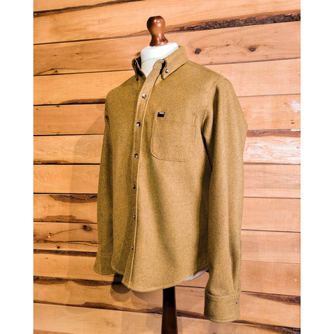 A pinewood-colored men's melton wool shirt displayed on a mannequin against a wooden backdrop.